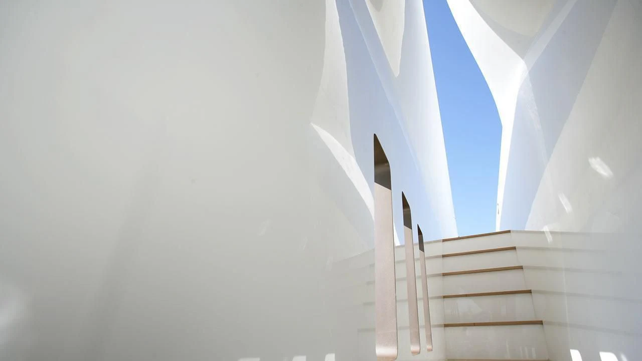 a staircase with a light aboard QHT Yacht for Sale