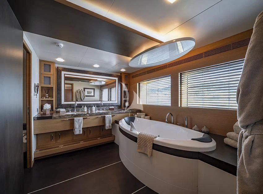 a bathroom with a large bathtub aboard QHT Yacht for Sale
