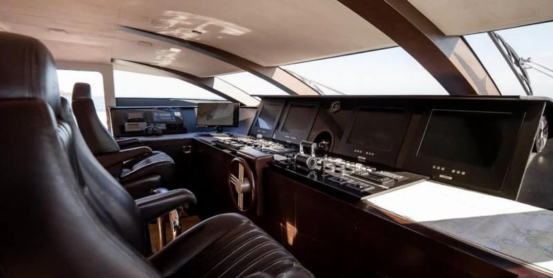 inside of a car with a row of monitors and a keyboard aboard QHT Yacht for Sale