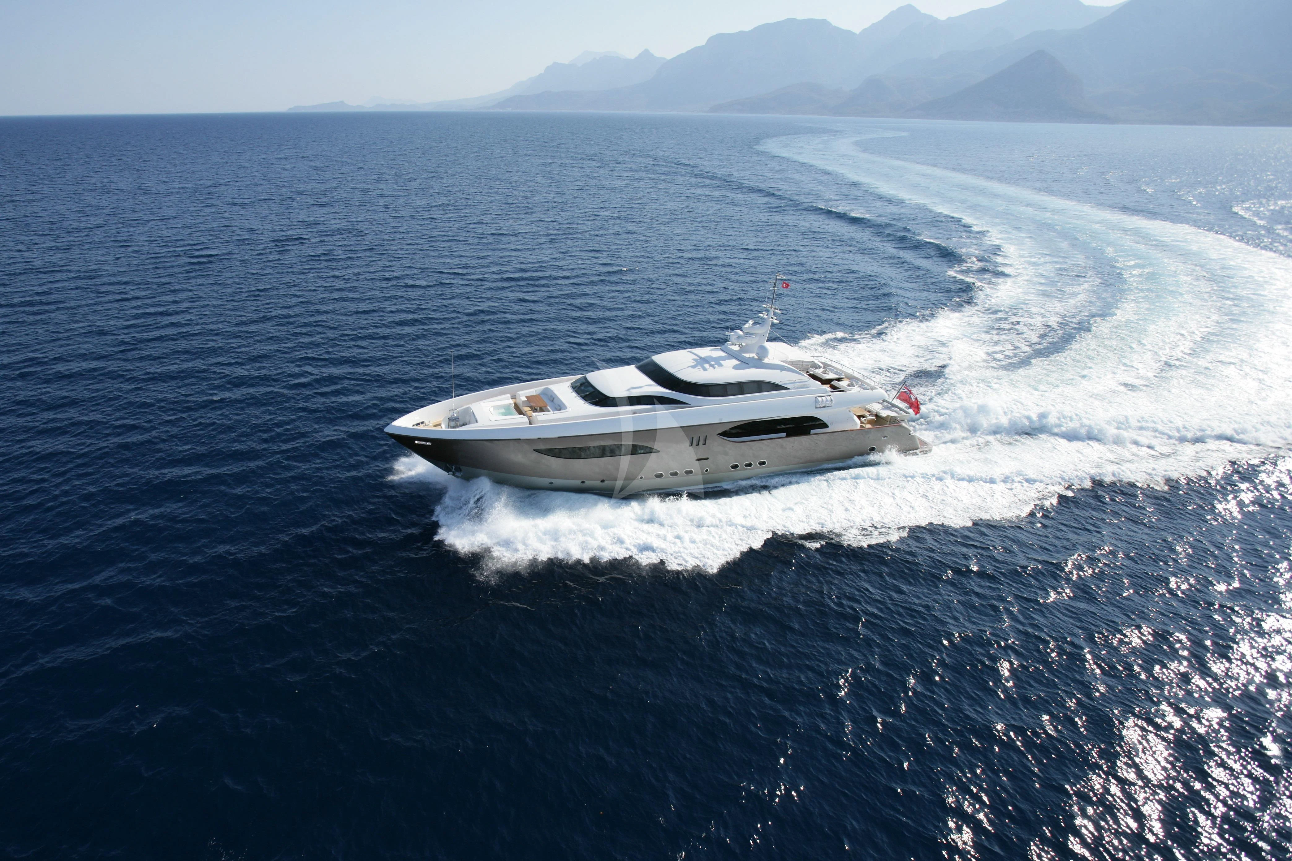 a white yacht in the water aboard QHT Yacht for Sale