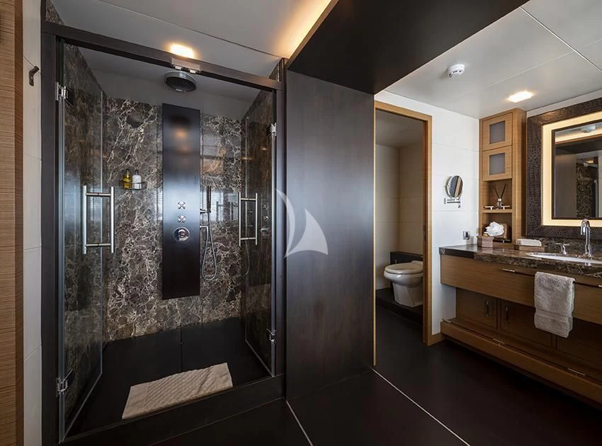 a bathroom with a large mirror aboard QHT Yacht for Sale