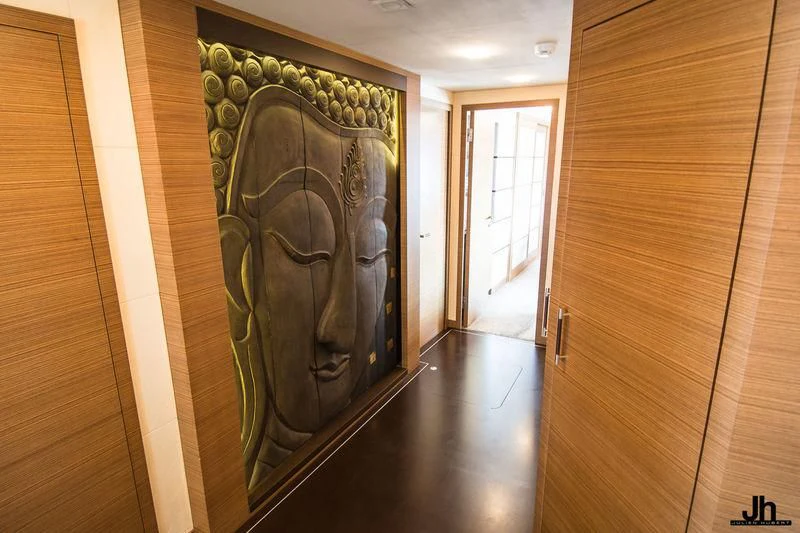 a wood wall with a painting on it aboard QHT Yacht for Sale