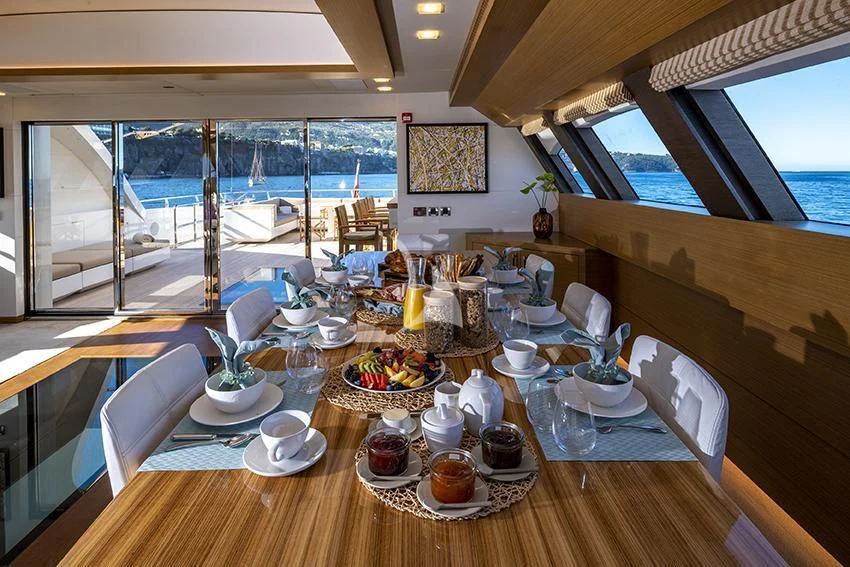 a table with food on it aboard QHT Yacht for Sale
