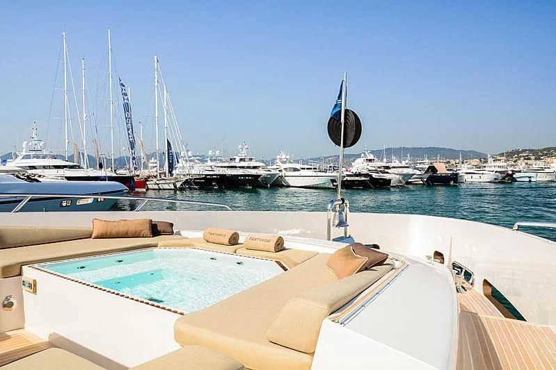 a boat is parked on the water aboard QHT Yacht for Sale