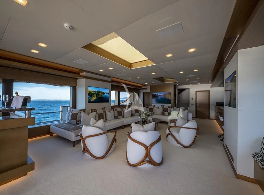 a large living room with a large window aboard QHT Yacht for Sale