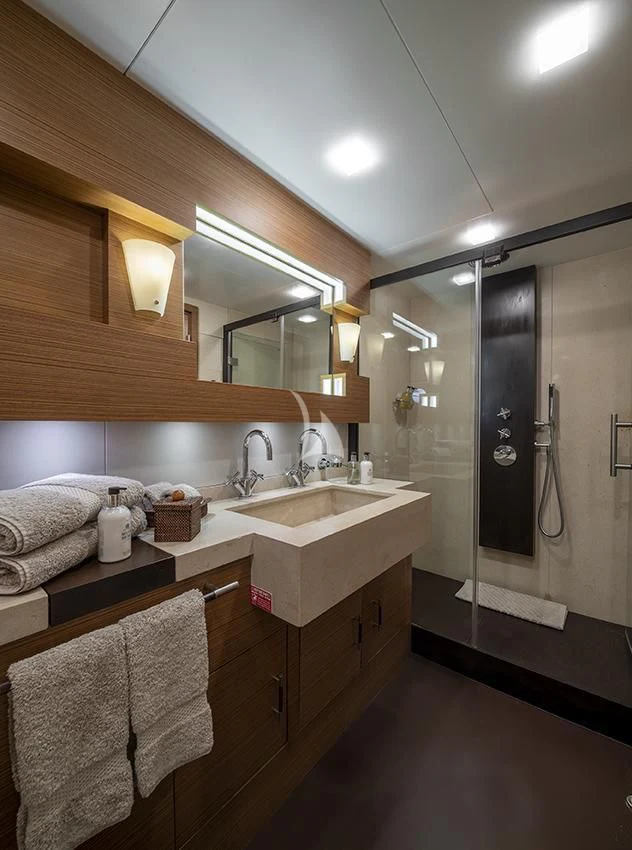 a bathroom with a sink and a mirror aboard QHT Yacht for Sale