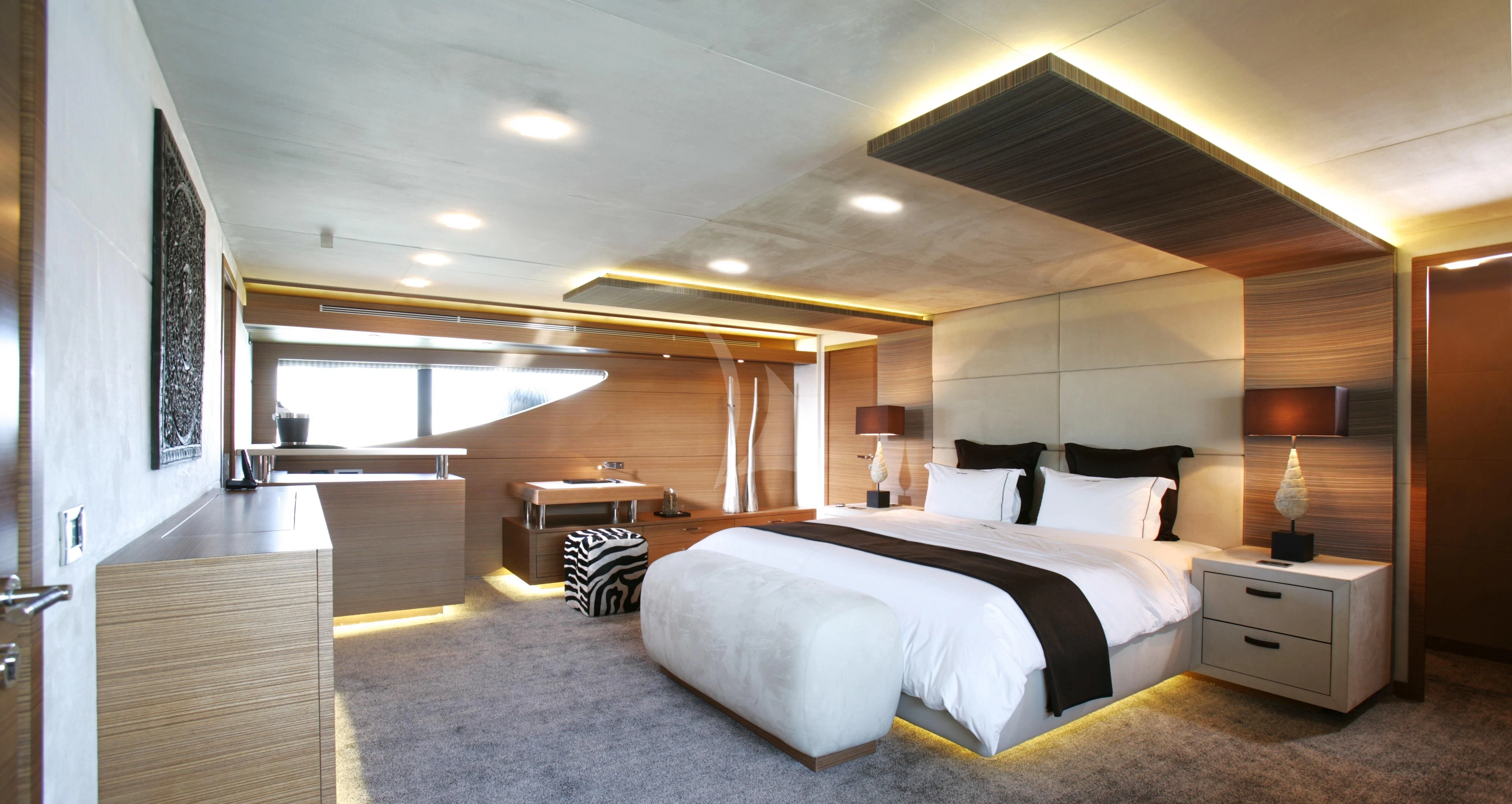 a large bedroom with a large bed aboard QHT Yacht for Sale
