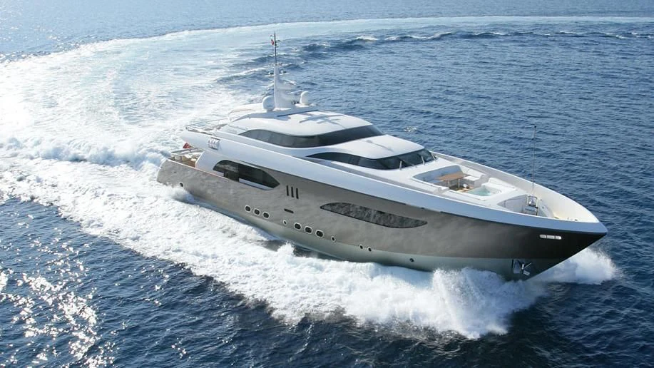 a white yacht on the water aboard QHT Yacht for Sale