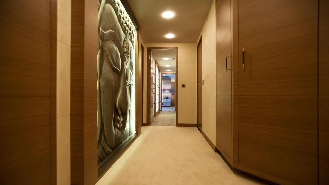 a hallway with a large mirror aboard QHT Yacht for Sale