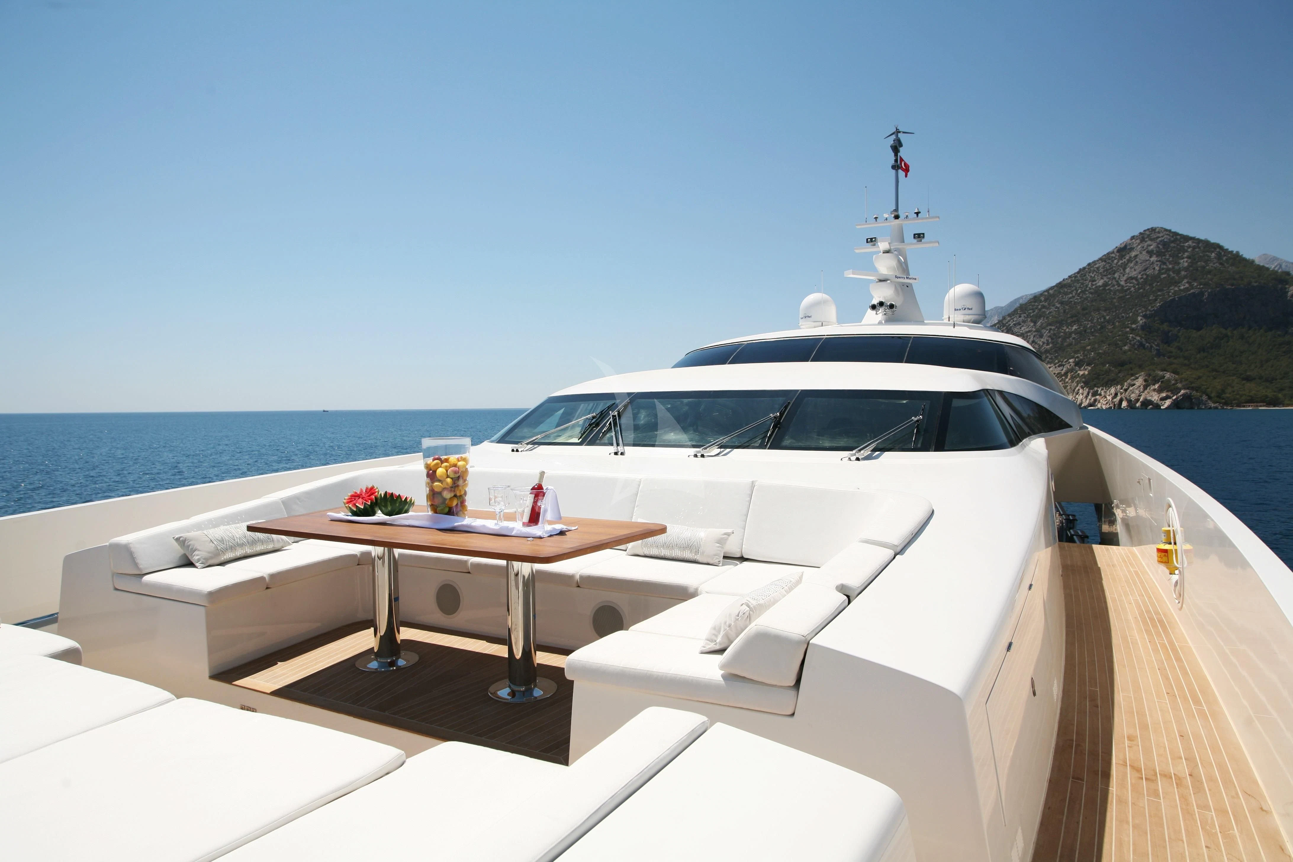 a white car on a boat aboard QHT Yacht for Sale