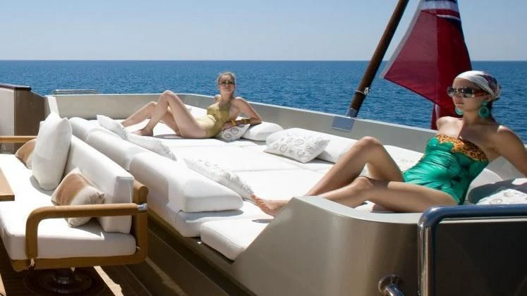 a group of people on a boat aboard QHT Yacht for Sale