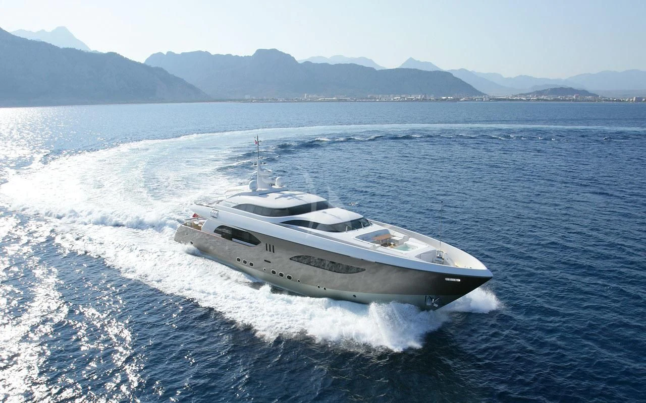 a white yacht on the water aboard QHT Yacht for Sale