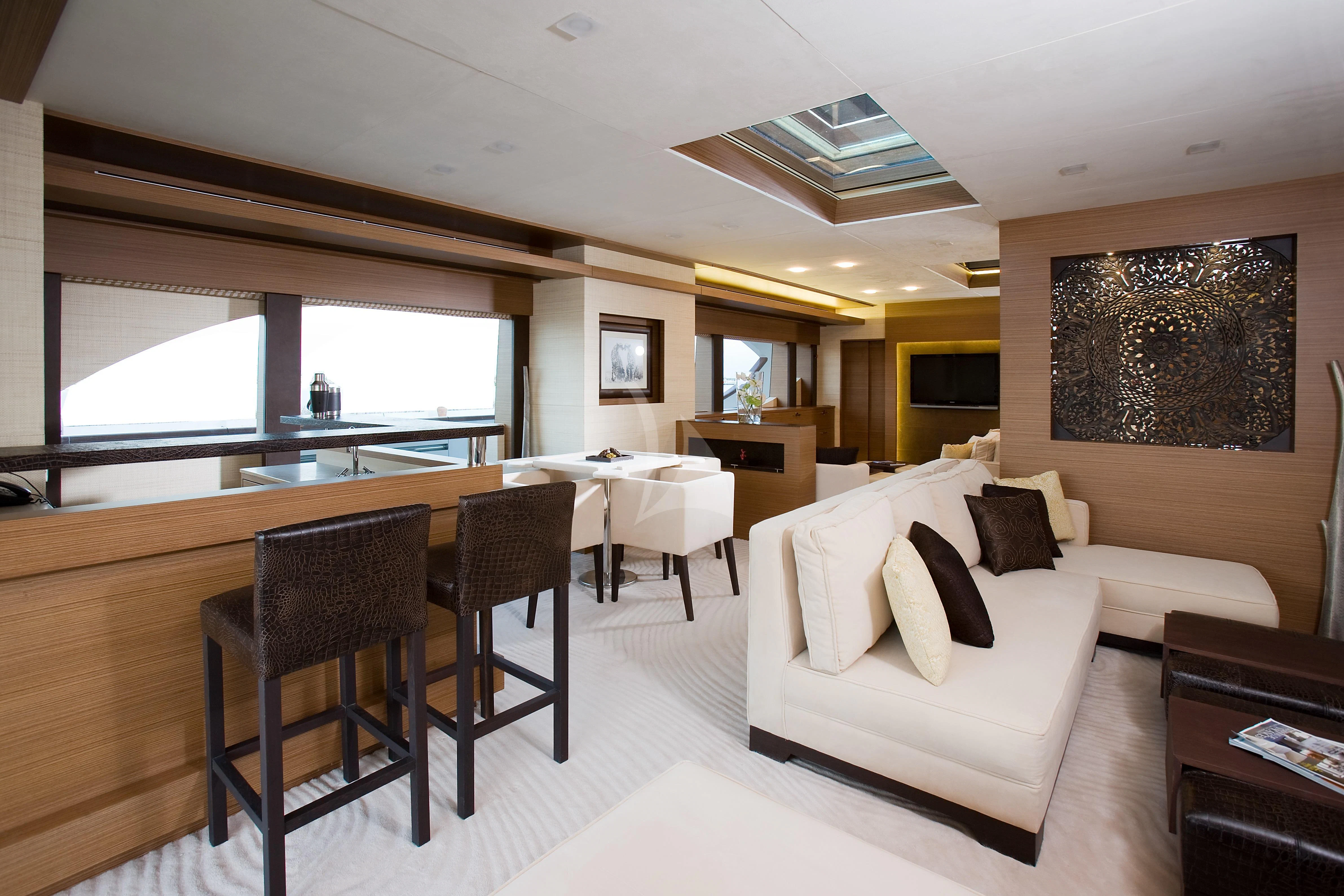 a living room with a couch and a table aboard QHT Yacht for Sale