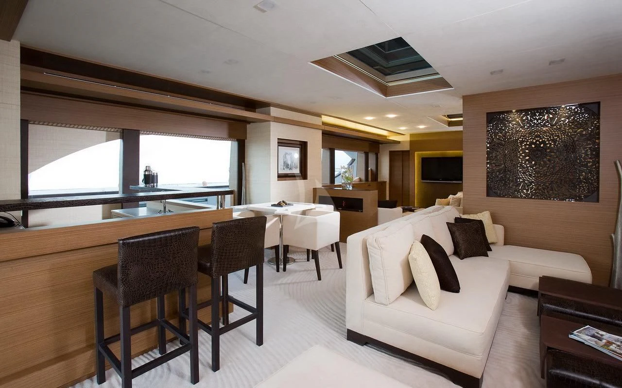 a living room with a couch and a table aboard QHT Yacht for Sale