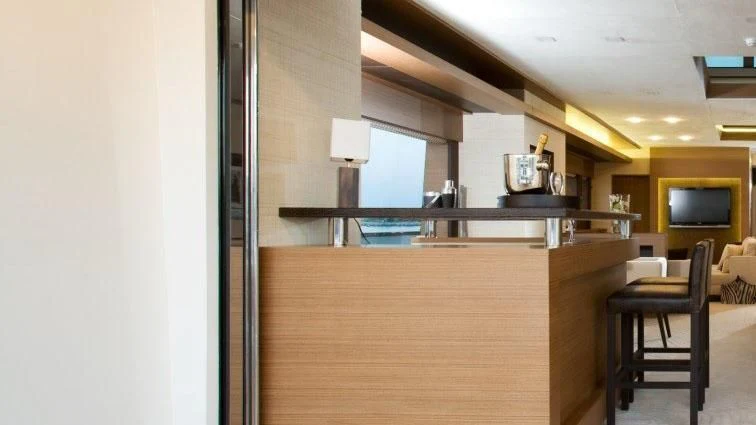 a room with a tv and a chair aboard QHT Yacht for Sale