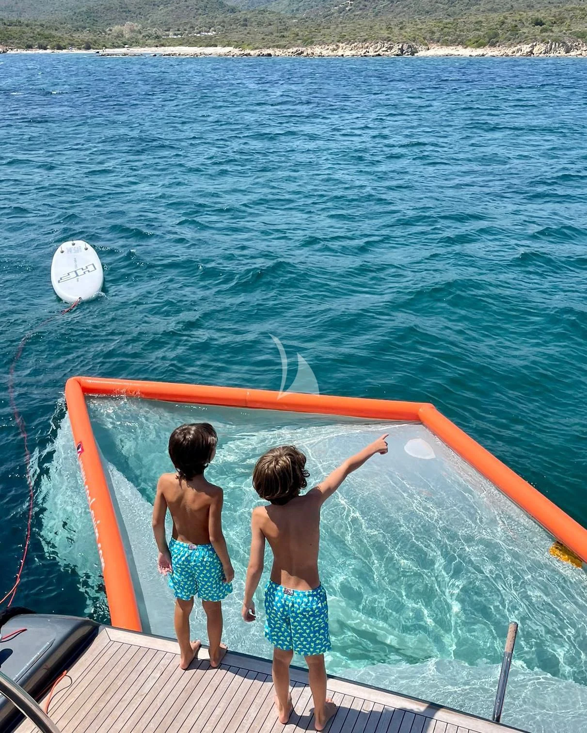 two children playing on a boat aboard MANU V Yacht for Sale