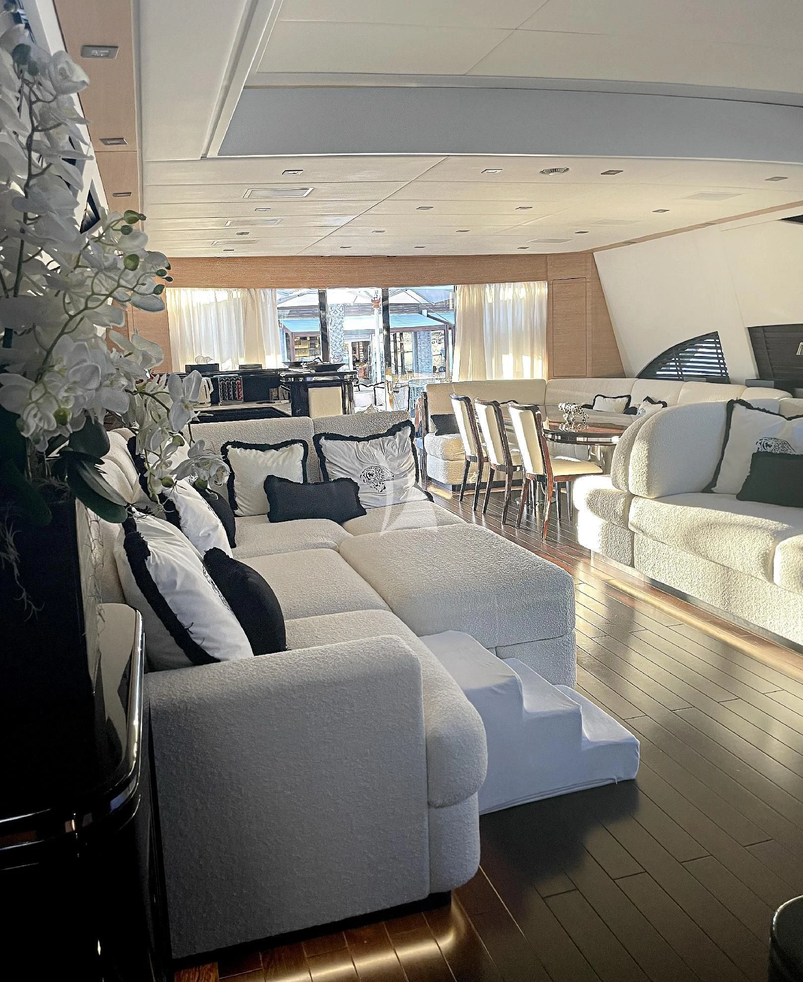 a living room with a large window aboard MANU V Yacht for Sale