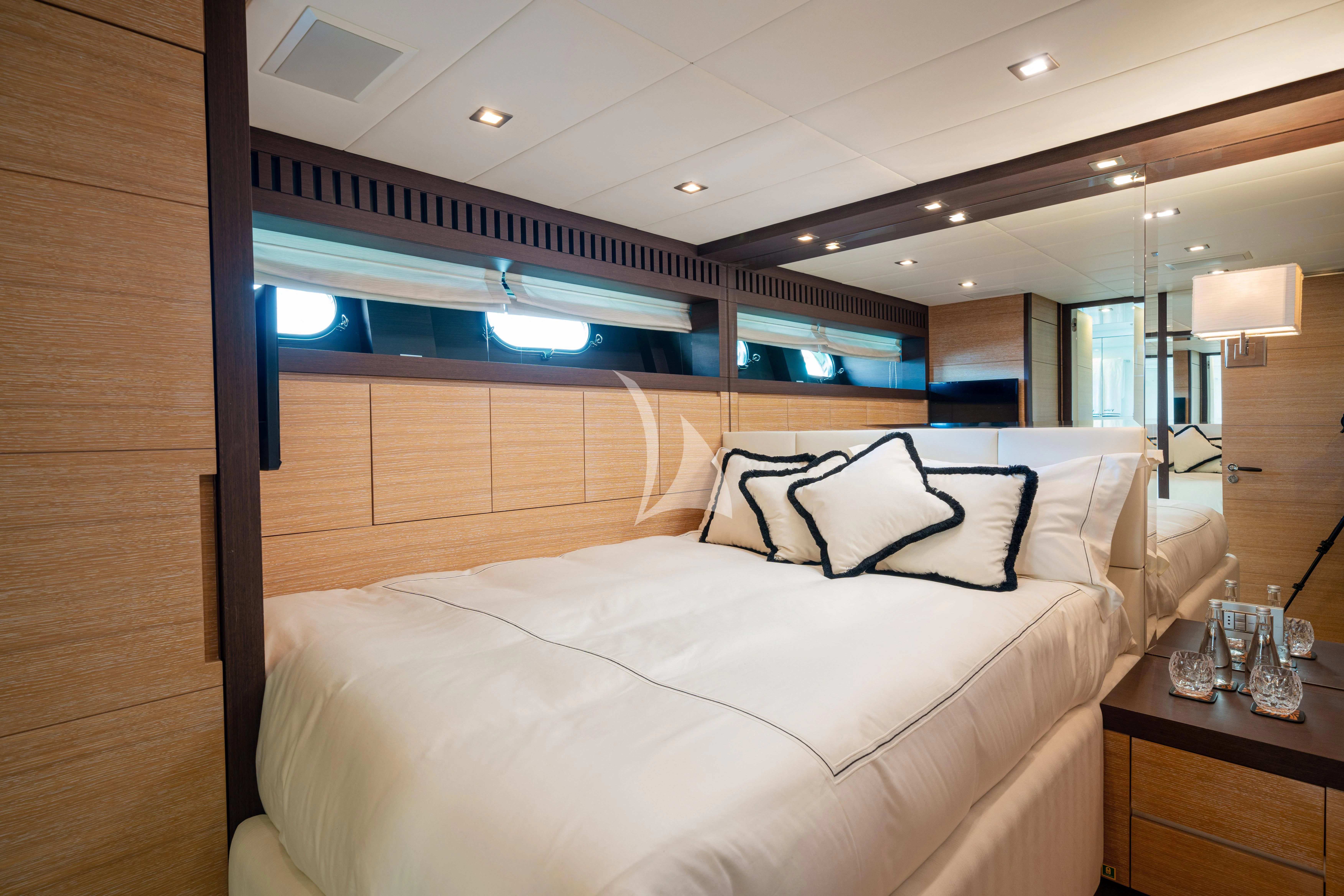 a bed in a room aboard MANU V Yacht for Sale