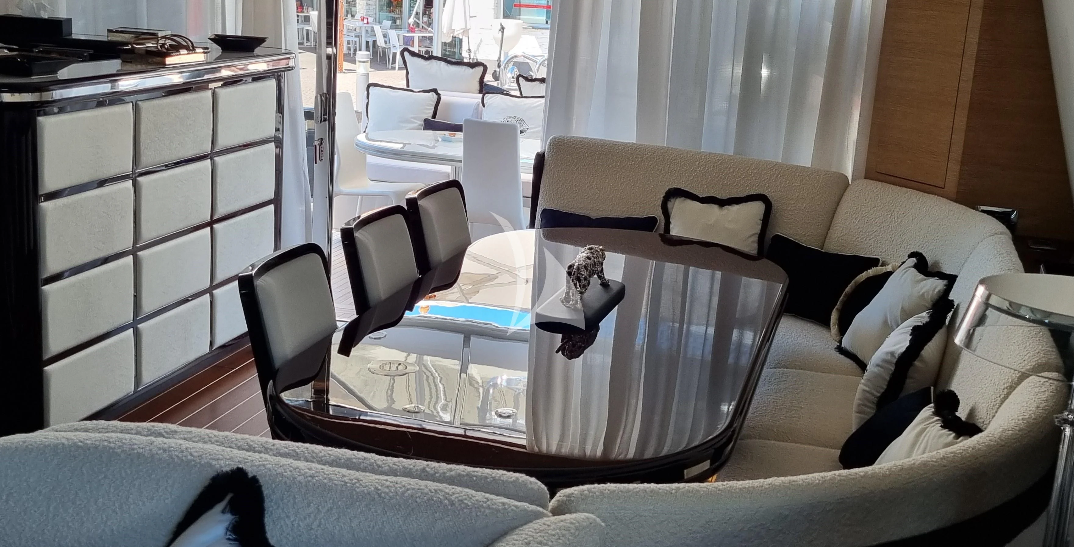 a room with a table and chairs aboard MANU V Yacht for Sale