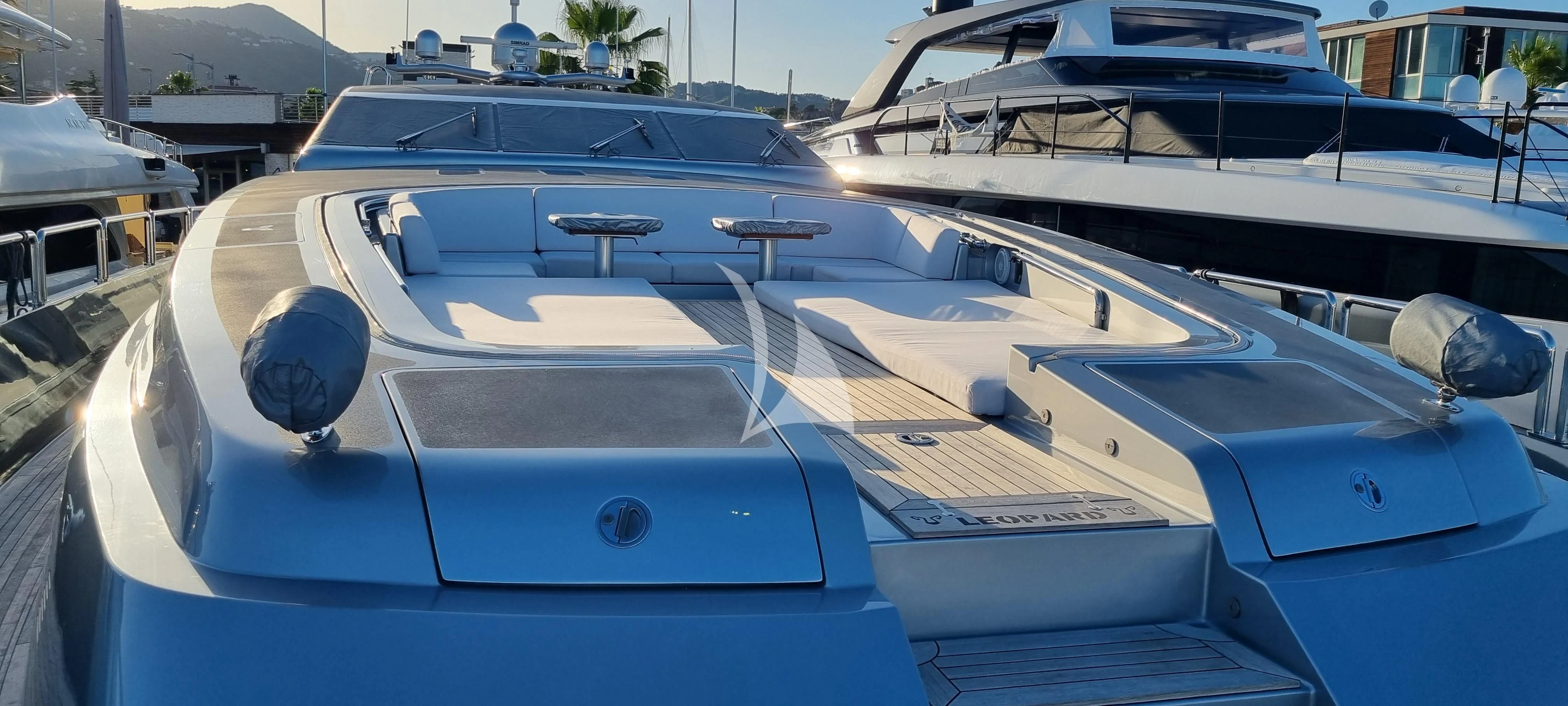 a white car parked in a parking lot aboard MANU V Yacht for Sale