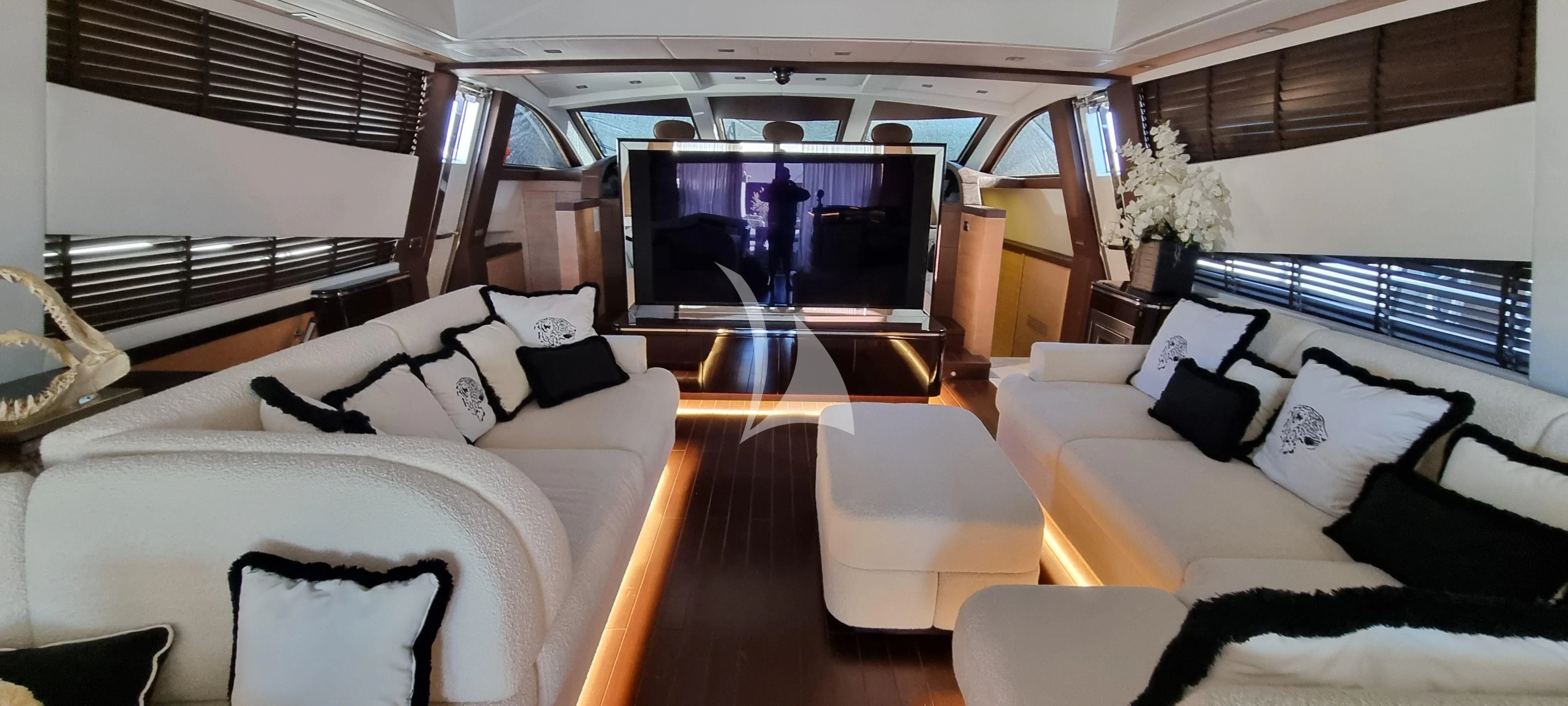 a room with a bed and a television aboard MANU V Yacht for Sale