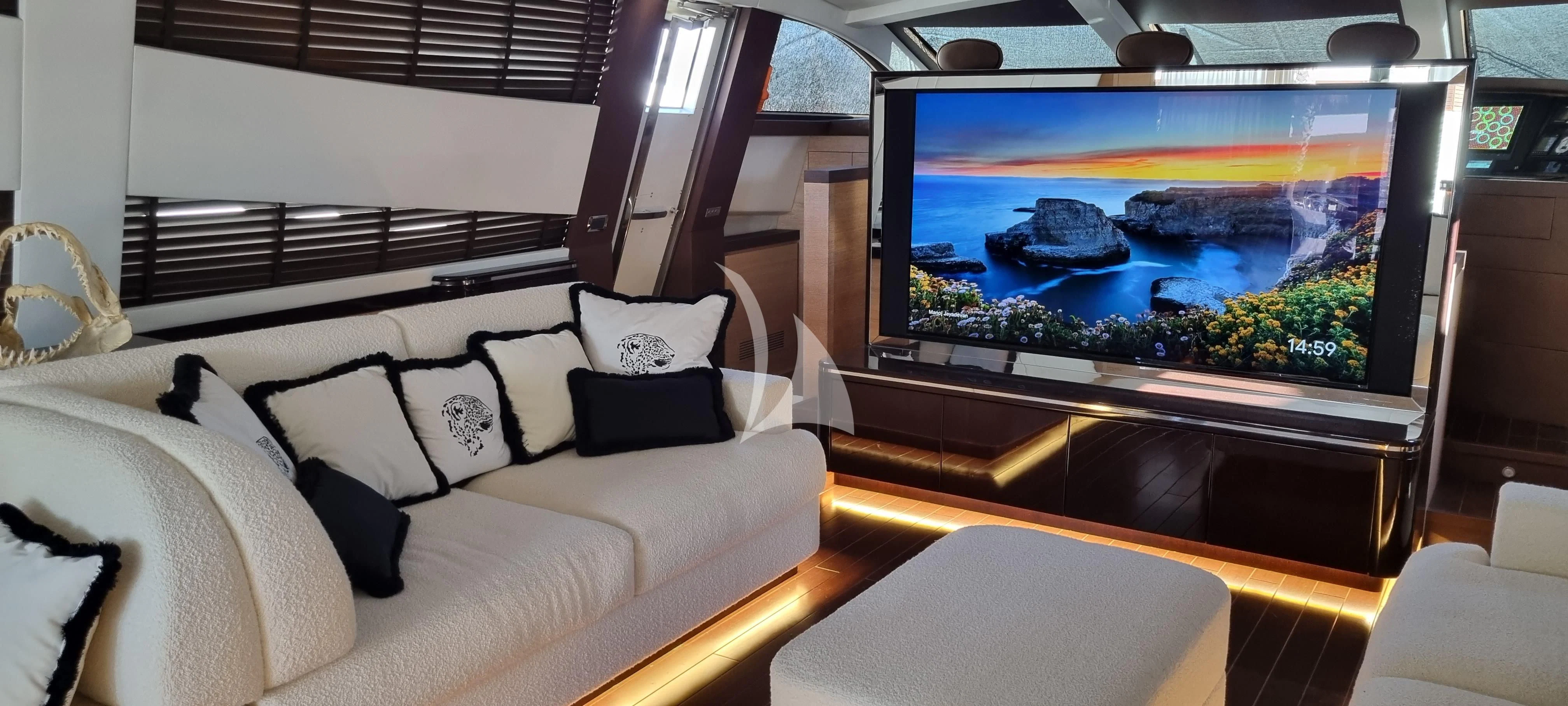 a television in a room aboard MANU V Yacht for Sale