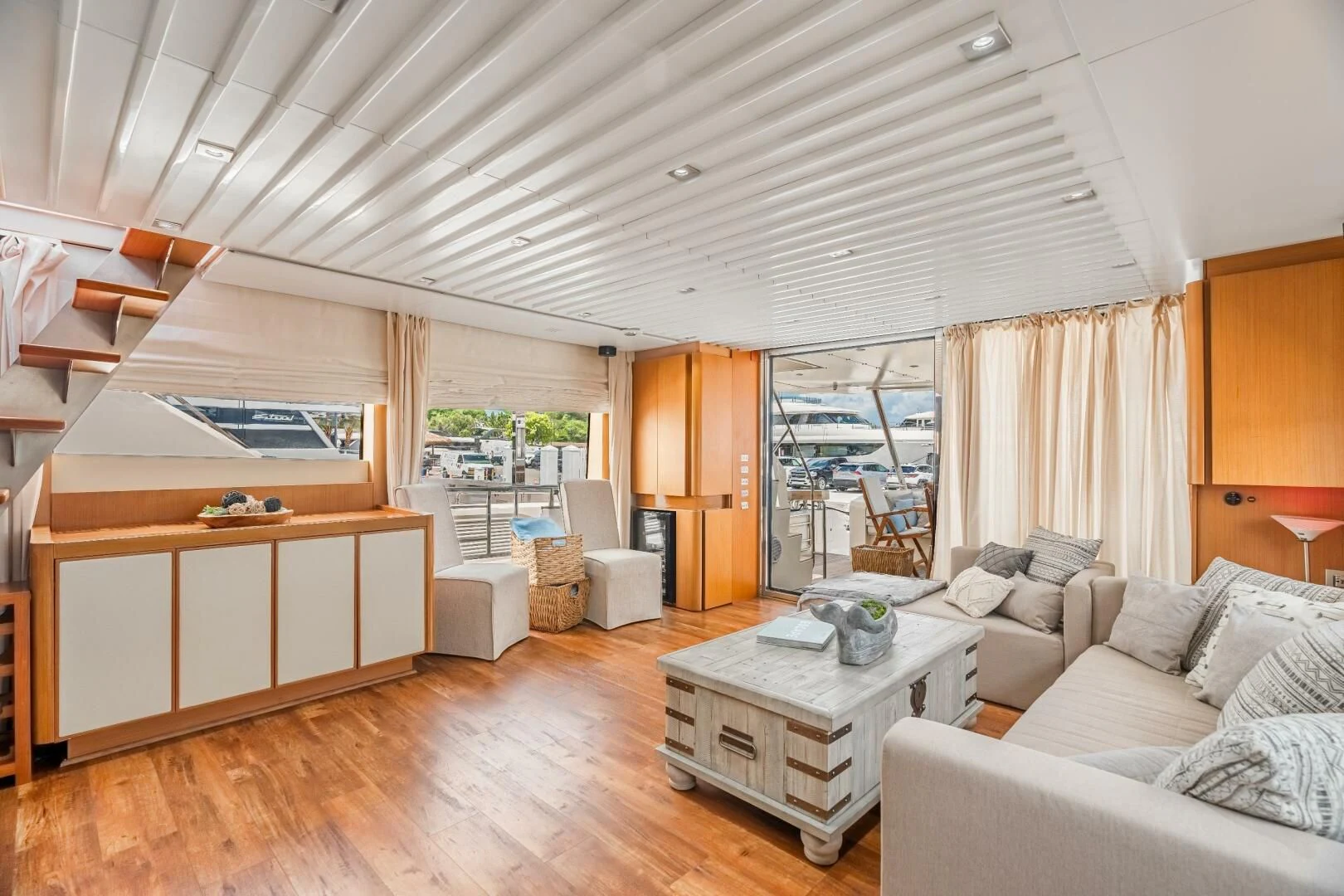 a living room with a large window aboard BLUWATER Yacht for Sale