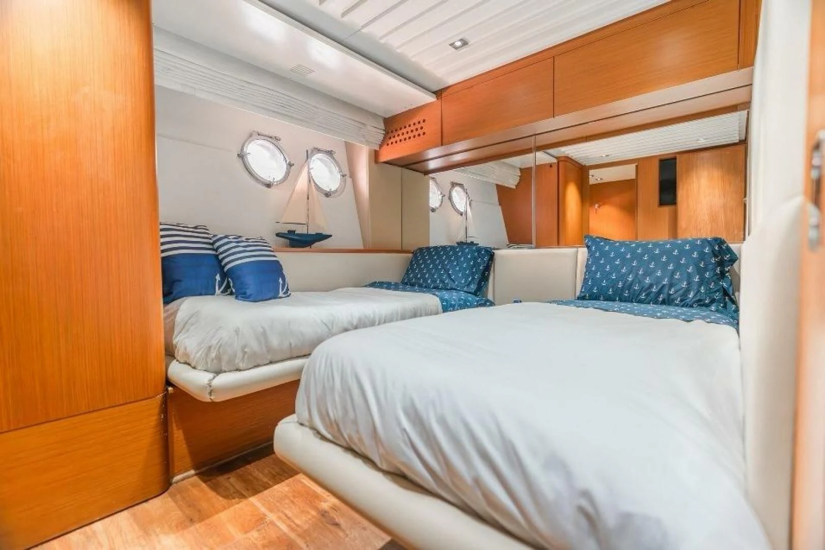 a room with beds and a bed aboard BLUWATER Yacht for Sale