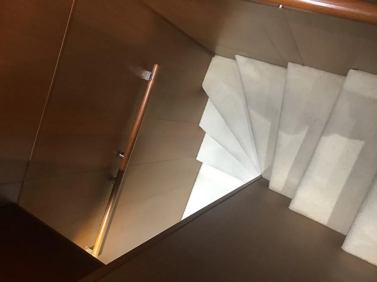 a few white folded towels on a bed aboard BLUWATER Yacht for Sale