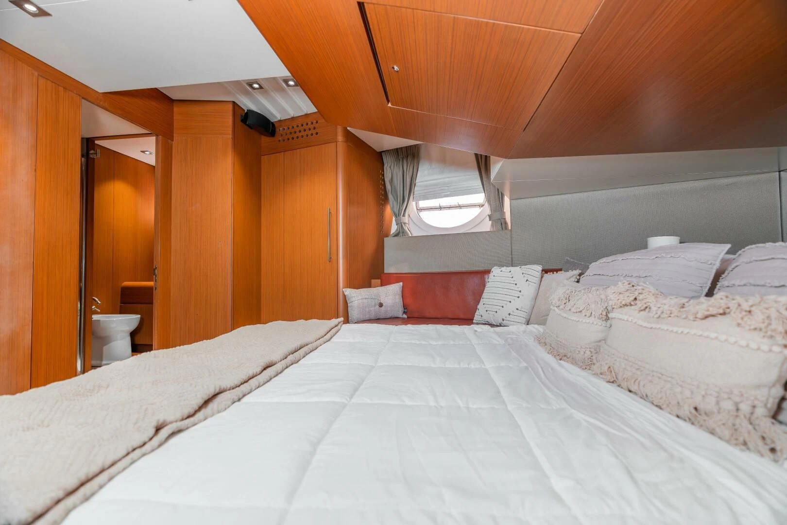 a room with a bed and a window aboard BLUWATER Yacht for Sale