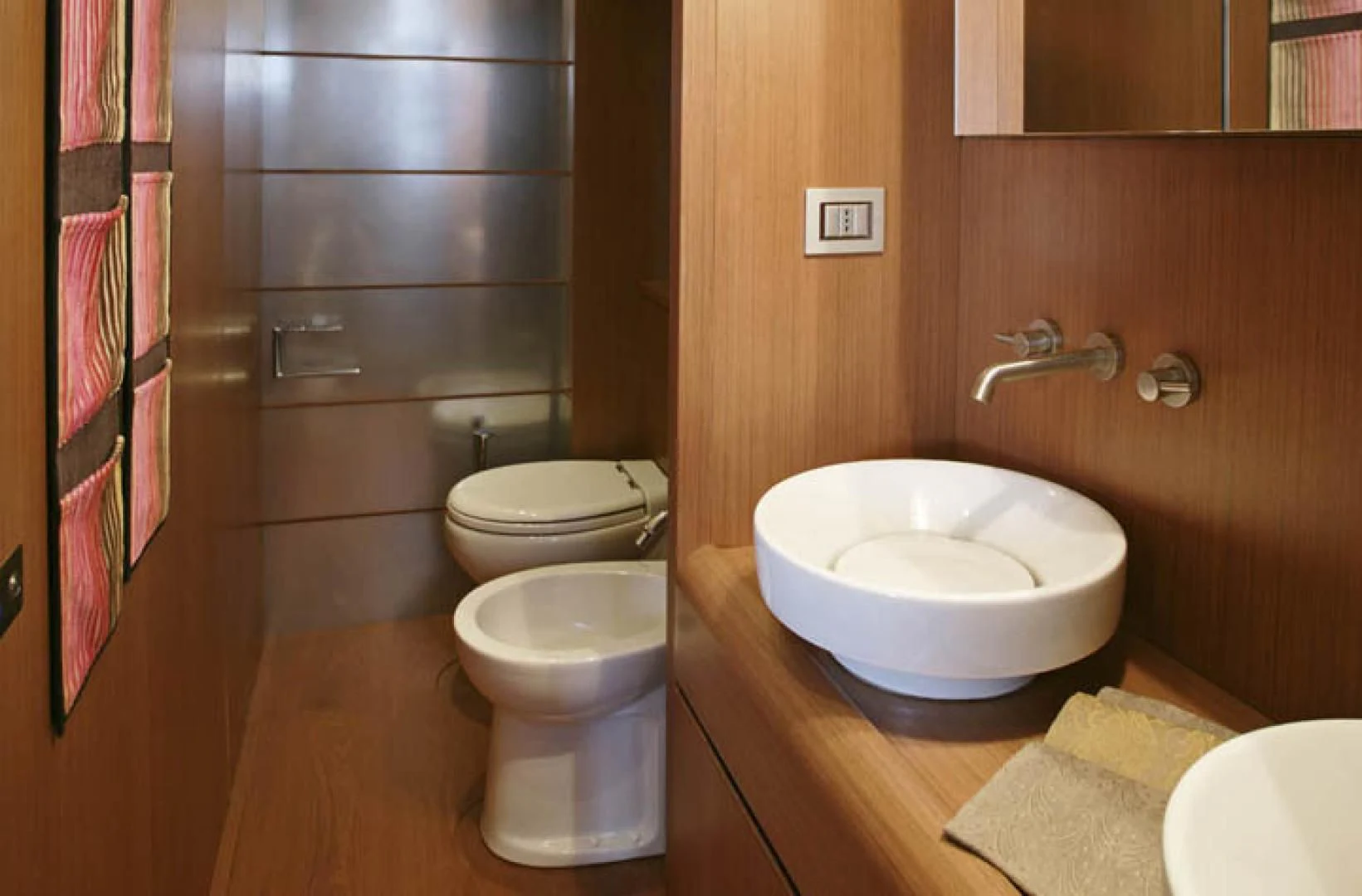 a bathroom with a sink and toilet aboard BLUWATER Yacht for Sale