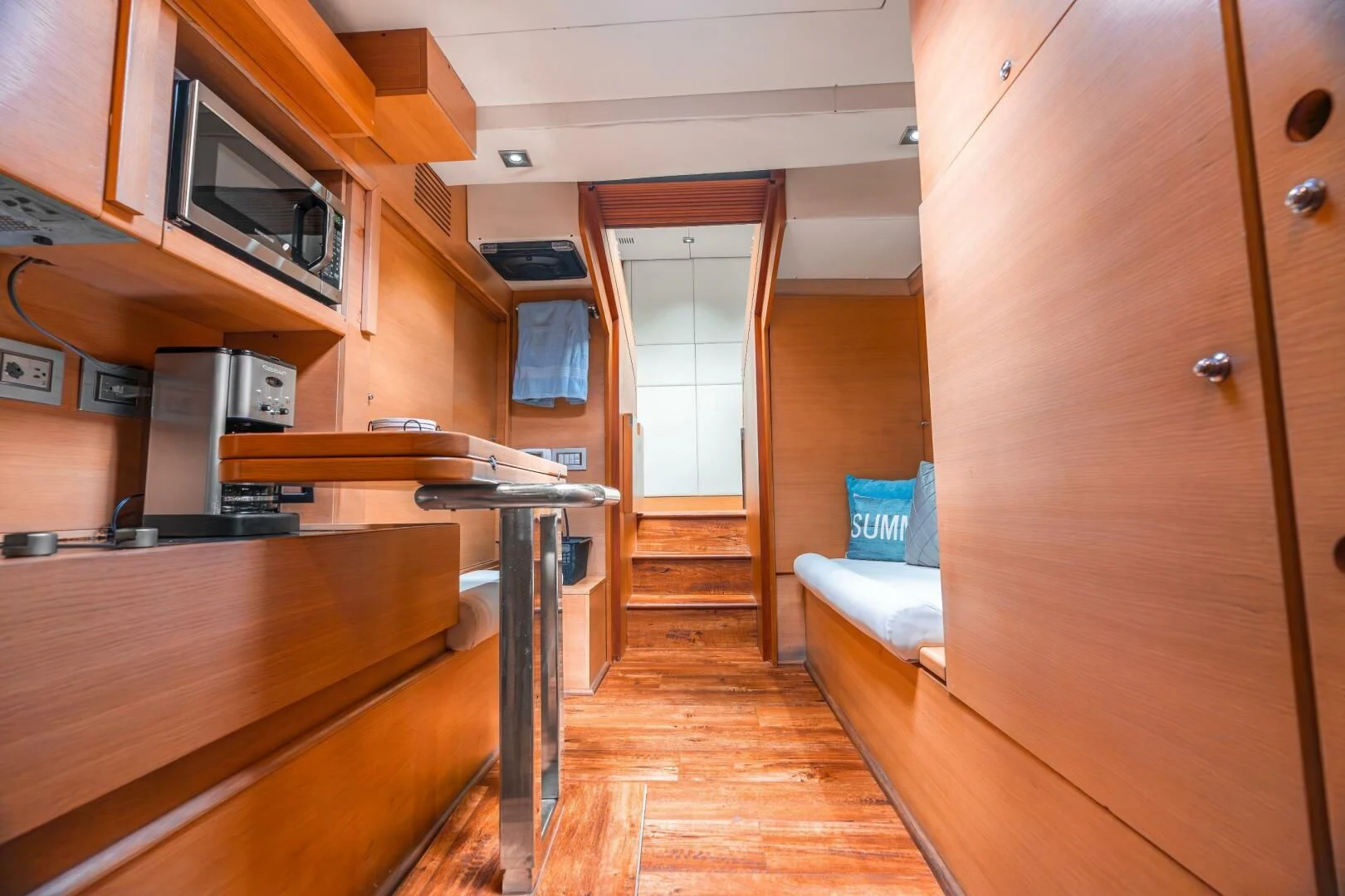 a kitchen with a table and a microwave aboard BLUWATER Yacht for Sale