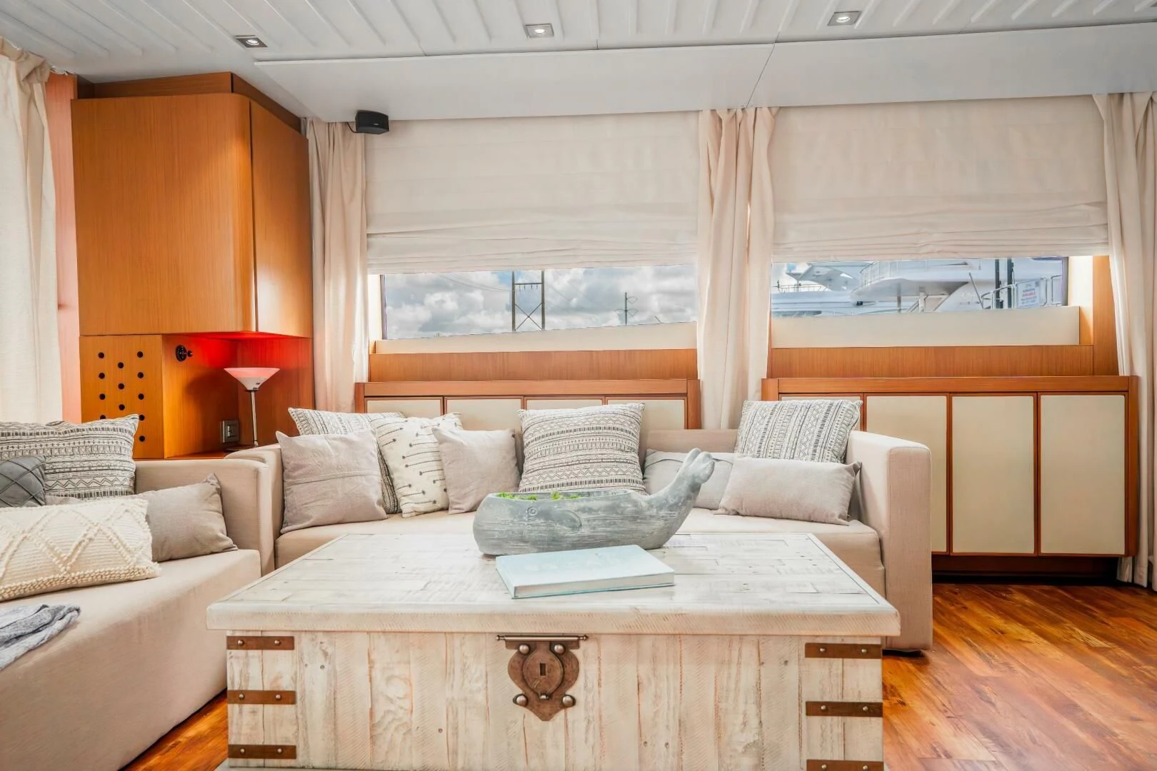 a living room with a couch and a table aboard BLUWATER Yacht for Sale