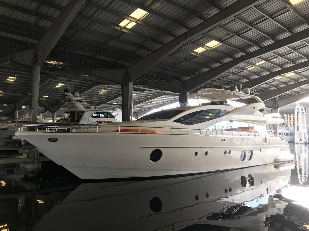 a white yacht in a building aboard BLUWATER Yacht for Sale