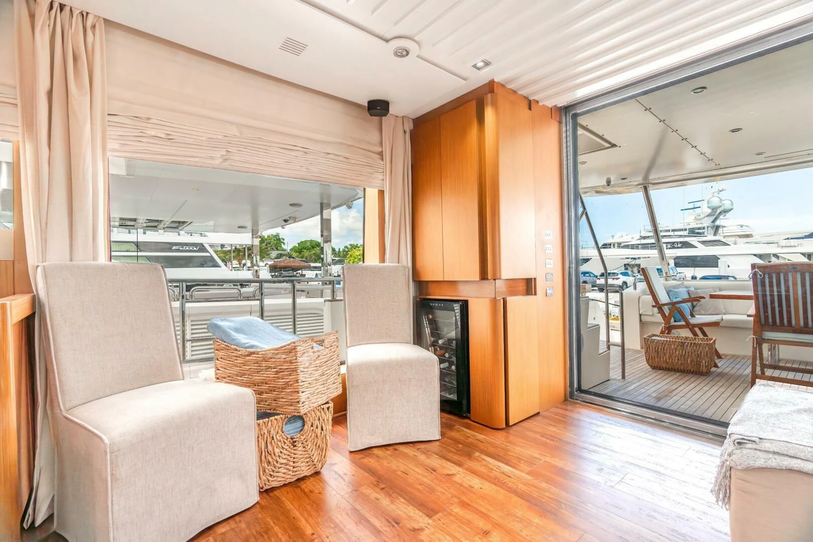 a living room with a wood floor aboard BLUWATER Yacht for Sale