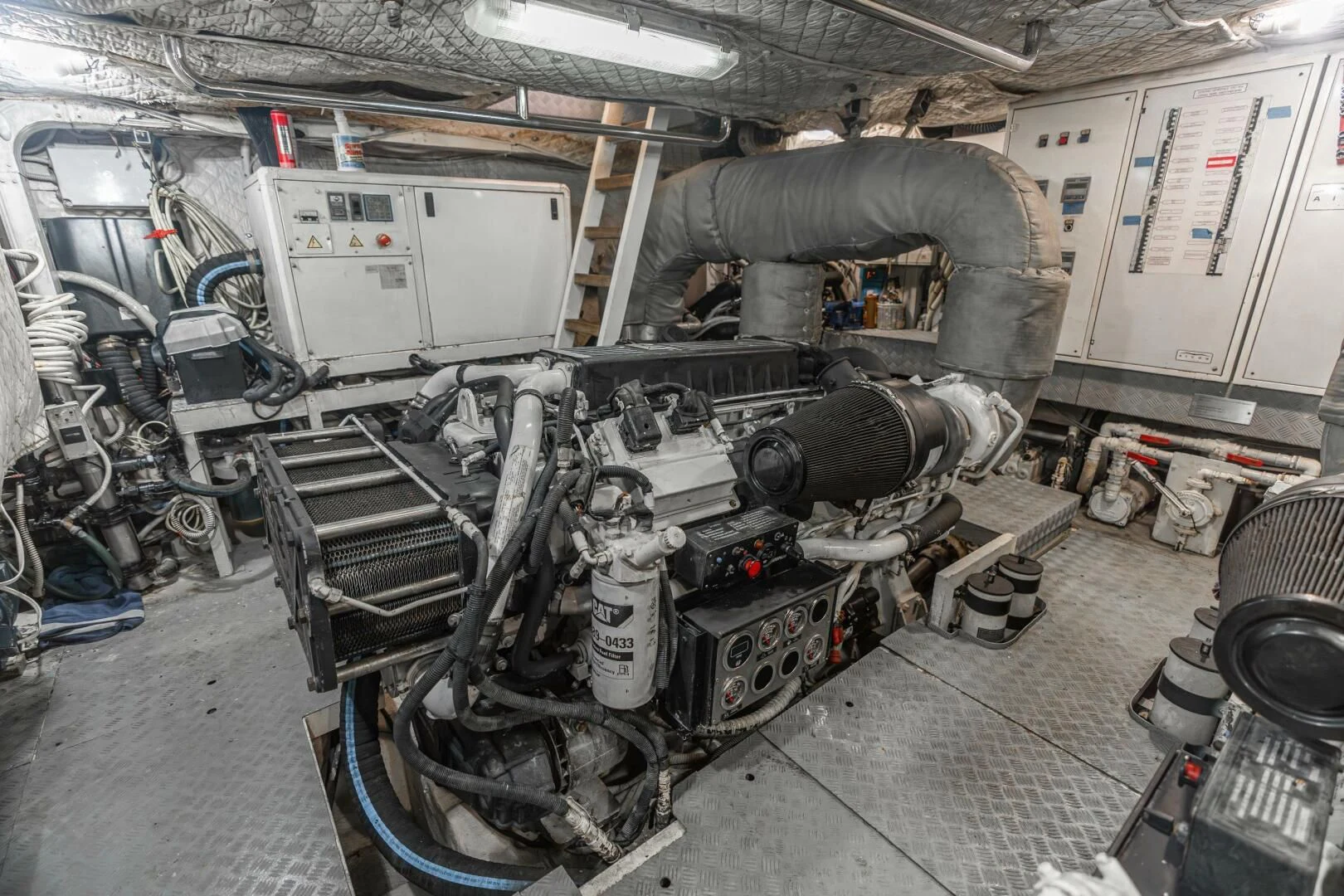 a machine with a large metal cylinder aboard BLUWATER Yacht for Sale