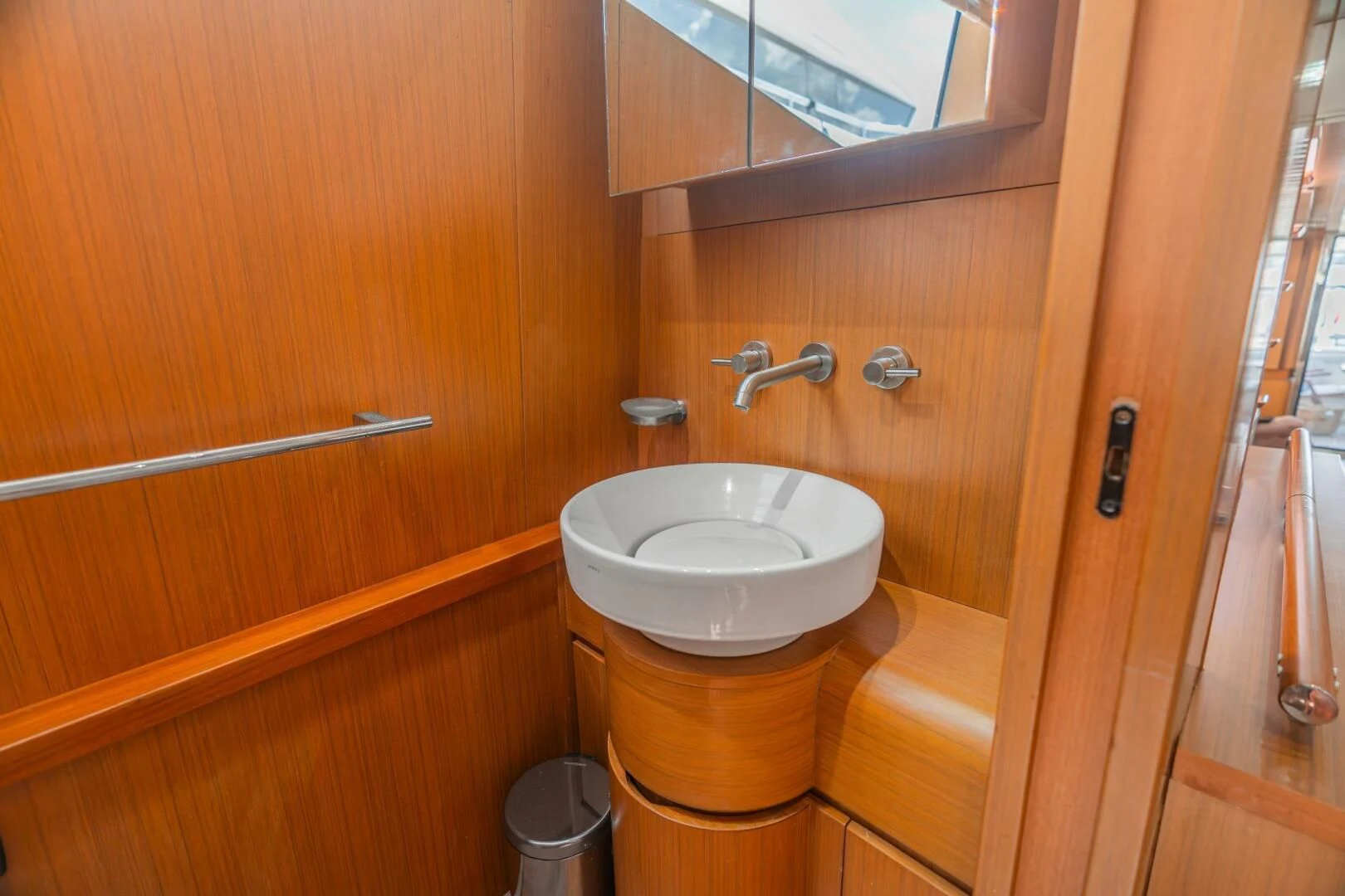 a bathroom with a sink and a mirror aboard BLUWATER Yacht for Sale