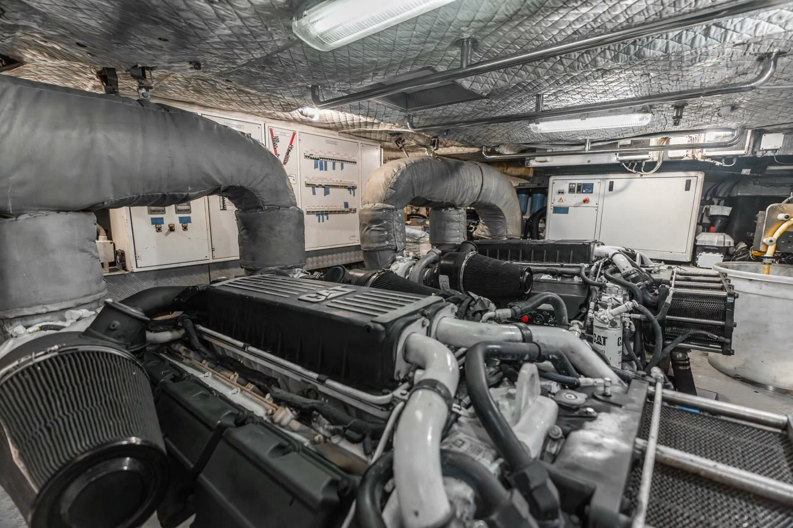 a large machine with a large metal cylinder aboard BLUWATER Yacht for Sale