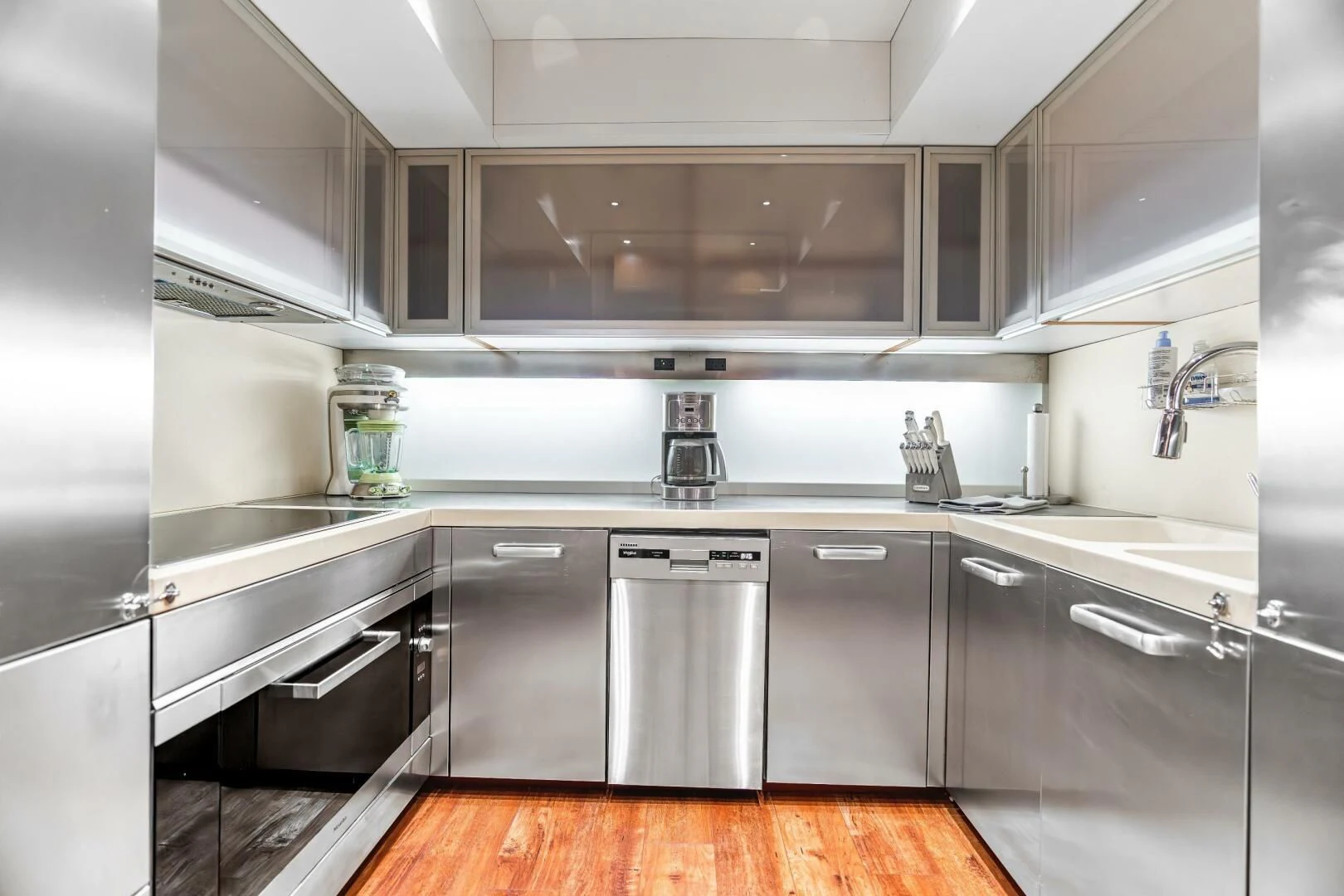 a kitchen with stainless steel appliances aboard BLUWATER Yacht for Sale