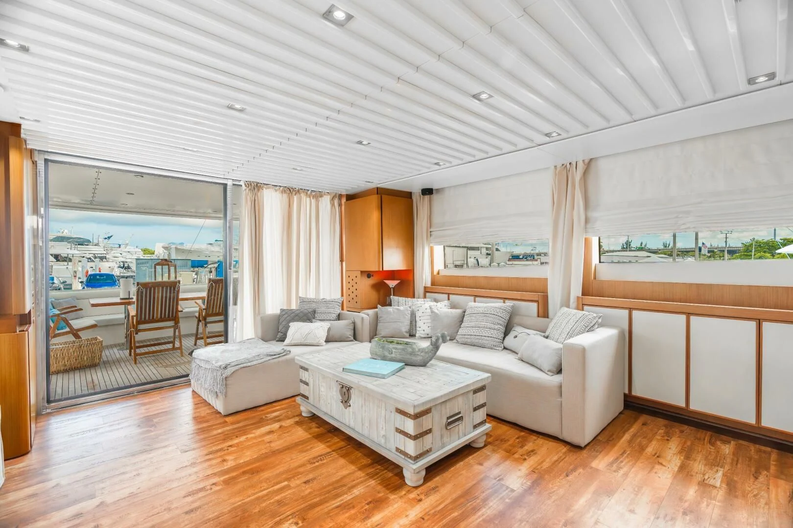 a living room with a large window aboard BLUWATER Yacht for Sale