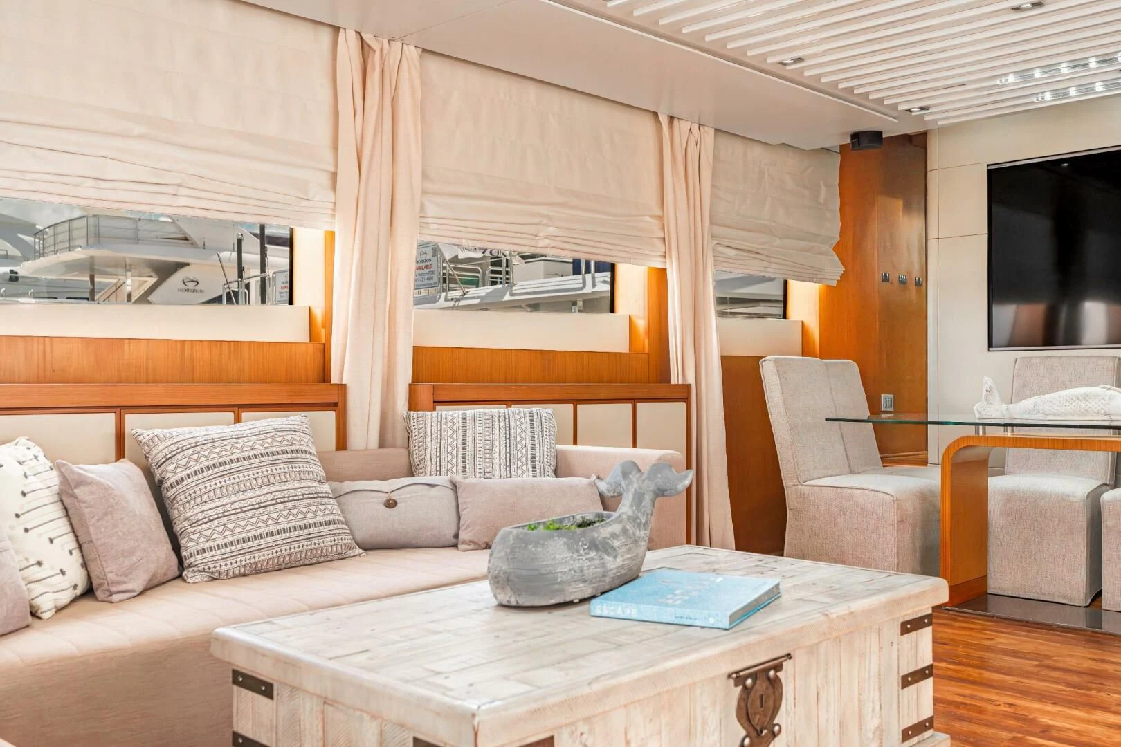 a room with a couch and a table aboard BLUWATER Yacht for Sale