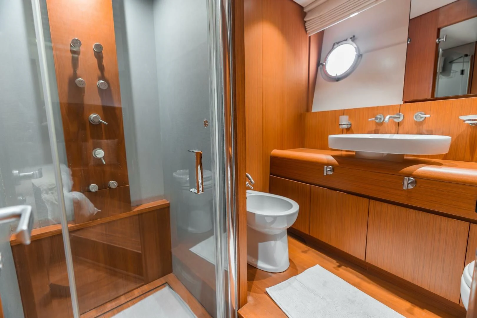 a bathroom with a standup shower aboard BLUWATER Yacht for Sale