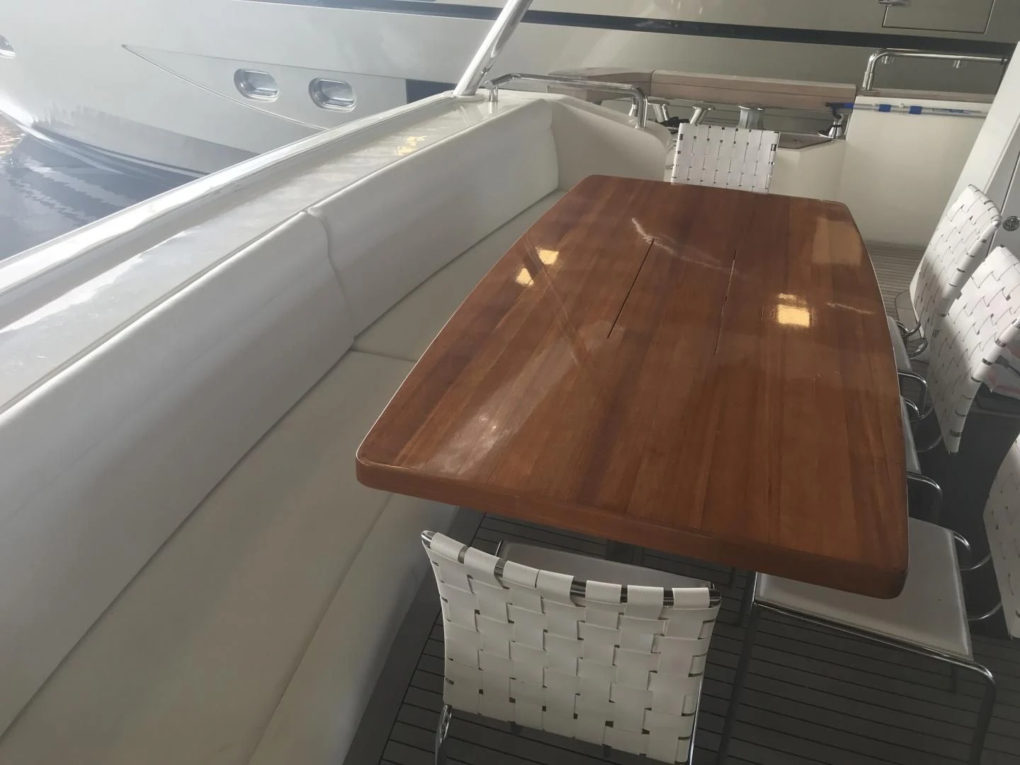 a wooden table on a boat aboard BLUWATER Yacht for Sale