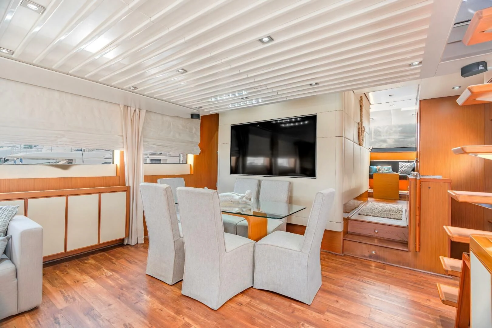 a room with a table and chairs aboard BLUWATER Yacht for Sale
