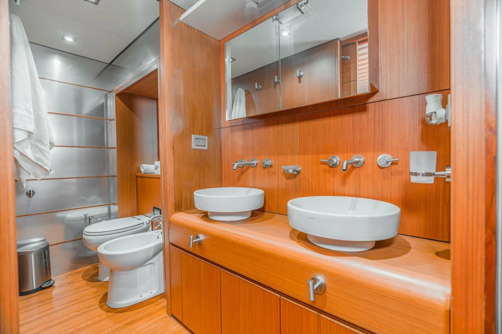 a bathroom with a toilet and a sink aboard BLUWATER Yacht for Sale