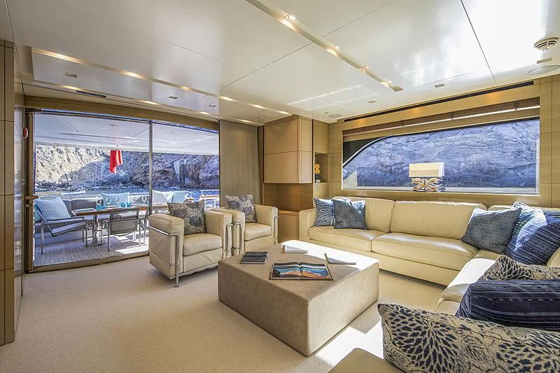 a living room with a large window aboard ELEFTHERIA Yacht for Sale