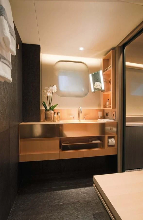 a bathroom with a sink and a mirror aboard ENTERPRISE Yacht for Sale