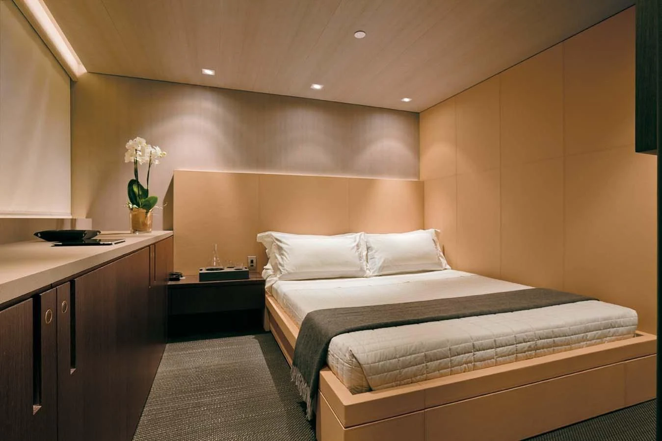 a room with a bed and desk aboard ENTERPRISE Yacht for Sale