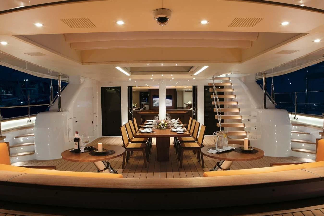 a large room with a staircase and tables aboard ENTERPRISE Yacht for Sale