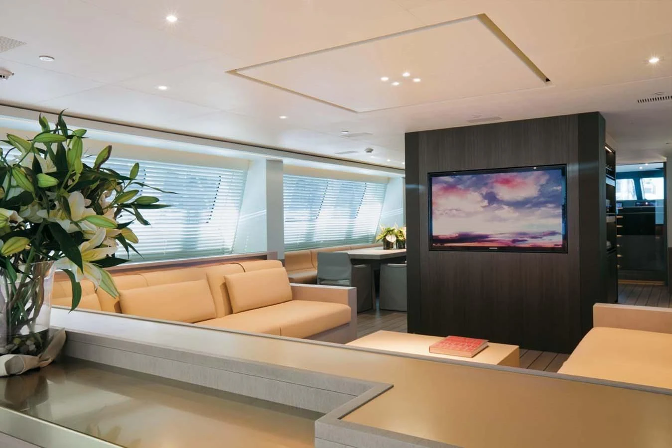 a room with a tv and couches aboard ENTERPRISE Yacht for Sale